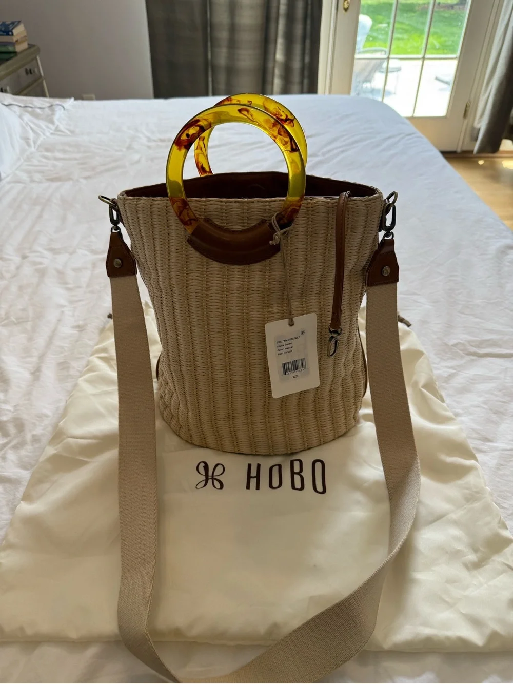 HOBO Straw Bucket Bag with Amber Resin Ring Handles